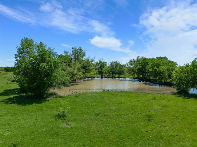 a view of lake with green space