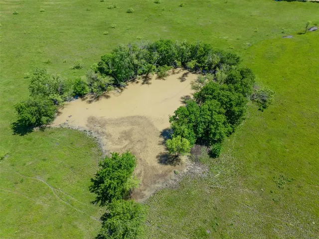 a view of a lake with a yard