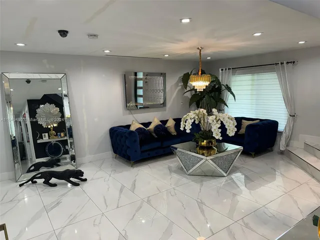 a living room with a couch and a flat screen tv