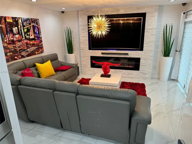 a view of a room with wooden floor and windows