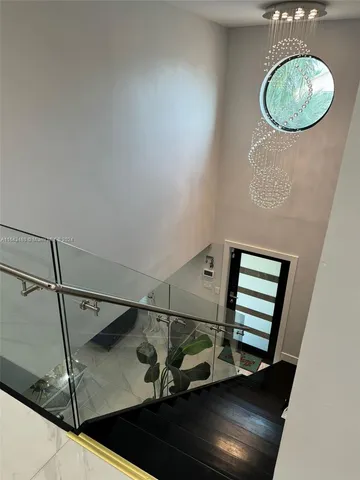 a bathroom with a sink vanity mirror and toilet