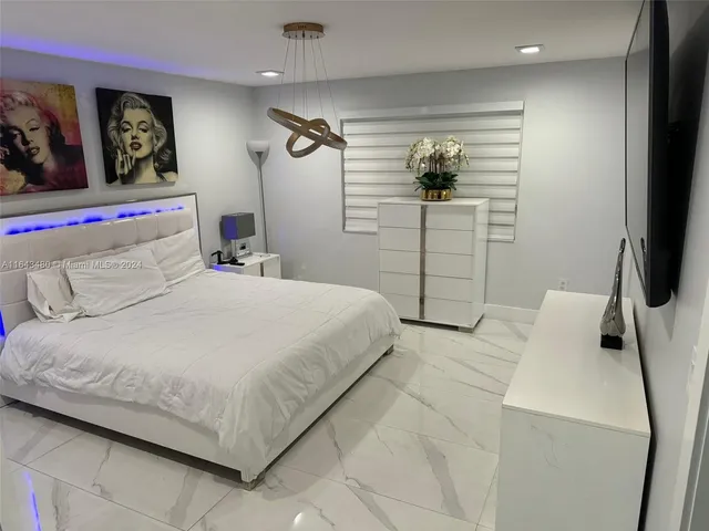 a view of a patio with couches chairs and a backyard