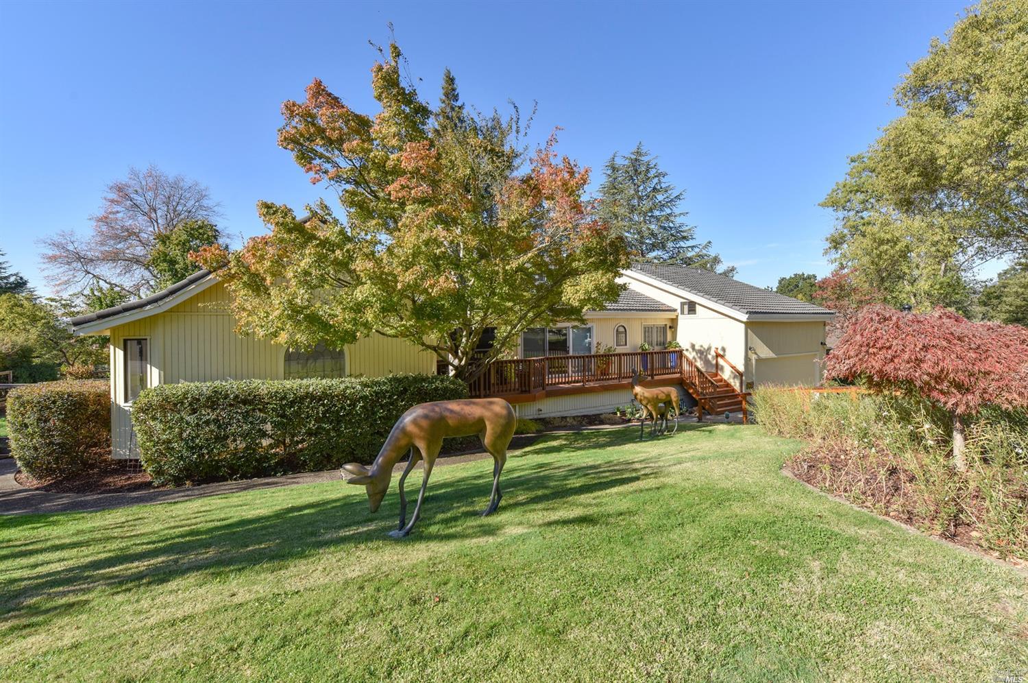 a house view with a sitting space and garden