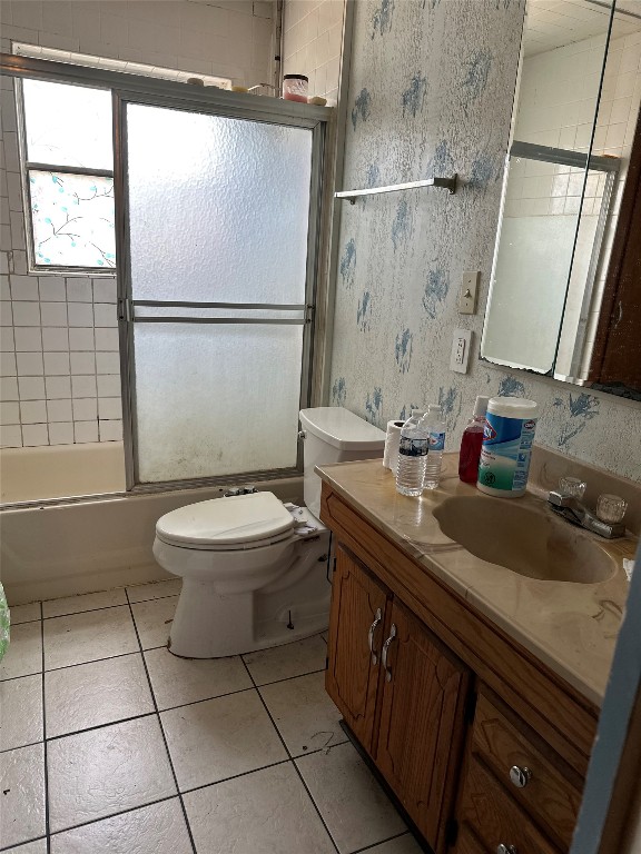 1001 Red Bud Street Channelview, TX 77530 - Photo 13 of 21 a bathroom with a granite countertop sink toilet a mirror and shower