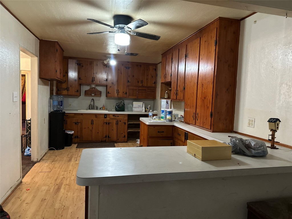 1001 Red Bud Street Channelview, TX 77530 - Photo 6 of 21 a kitchen with kitchen island granite countertop a sink stainless steel appliances and cabinets
