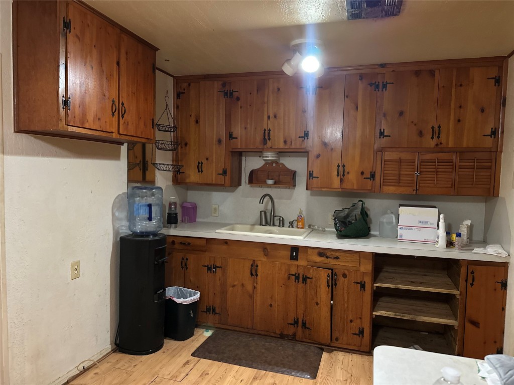 1001 Red Bud Street Channelview, TX 77530 - Photo 8 of 21 a kitchen with a sink and cabinets