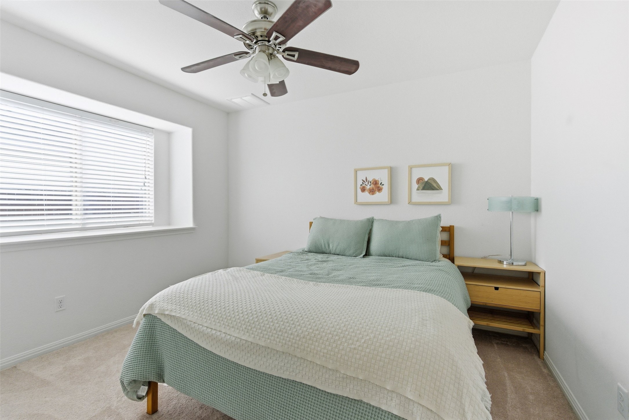 2513 Winchell Lane Austin, TX 78725 - Photo 10 of 23 a bedroom with a bed and a window