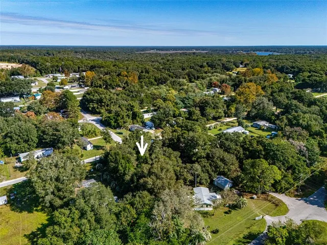 a view of a field with an ocean