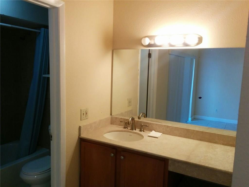 11229 Southwest 152nd Terrace Miami, FL 33157 - Photo 11 of 26 a bathroom with a sink and a mirror
