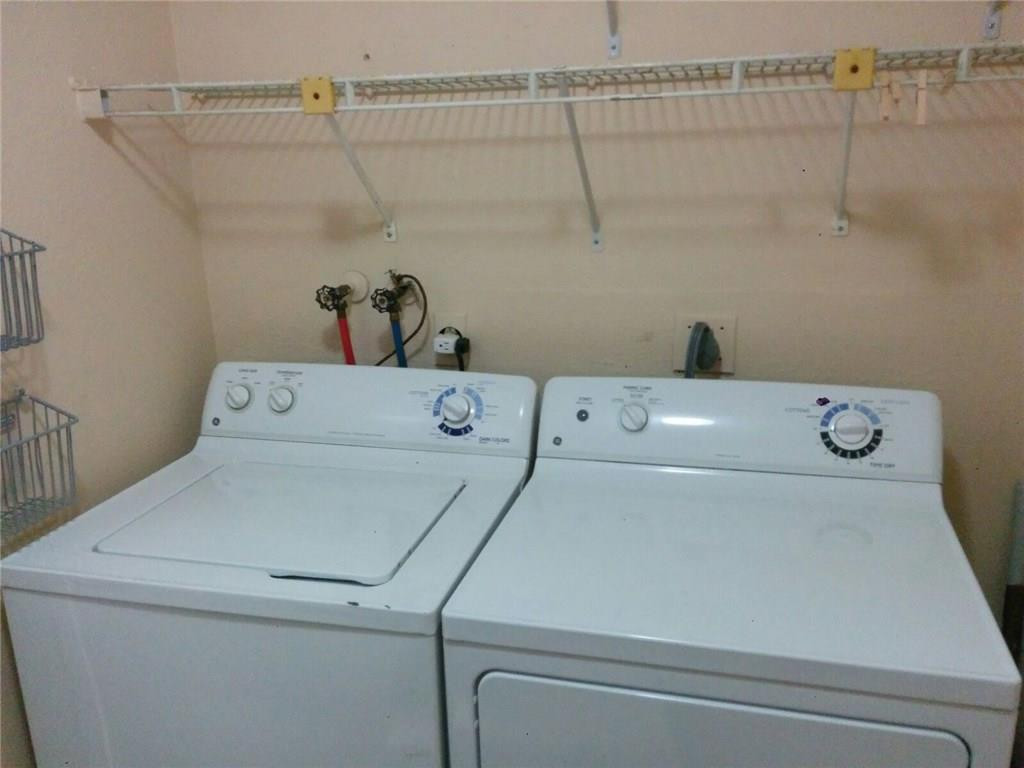 11229 Southwest 152nd Terrace Miami, FL 33157 - Photo 16 of 26 a close up view of washer and dryer