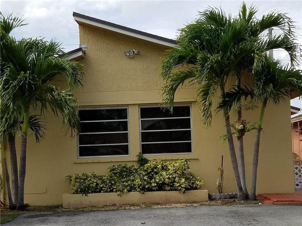 11229 Southwest 152nd Terrace Miami, FL 33157 - Photo 2 of 26 a front view of a house