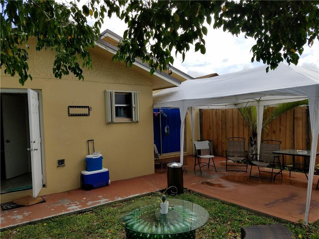 11229 Southwest 152nd Terrace Miami, FL 33157 - Photo 21 of 26 a view of a house with backyard and sitting area
