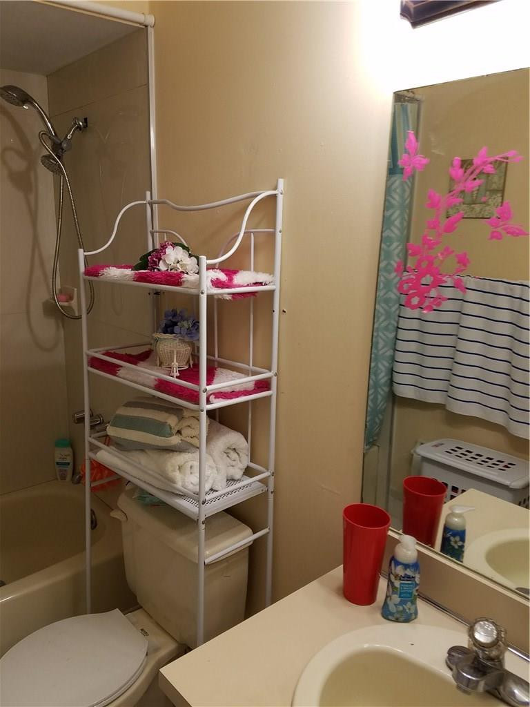 11229 Southwest 152nd Terrace Miami, FL 33157 - Photo 22 of 26 a bathroom with a sink toilet and shower