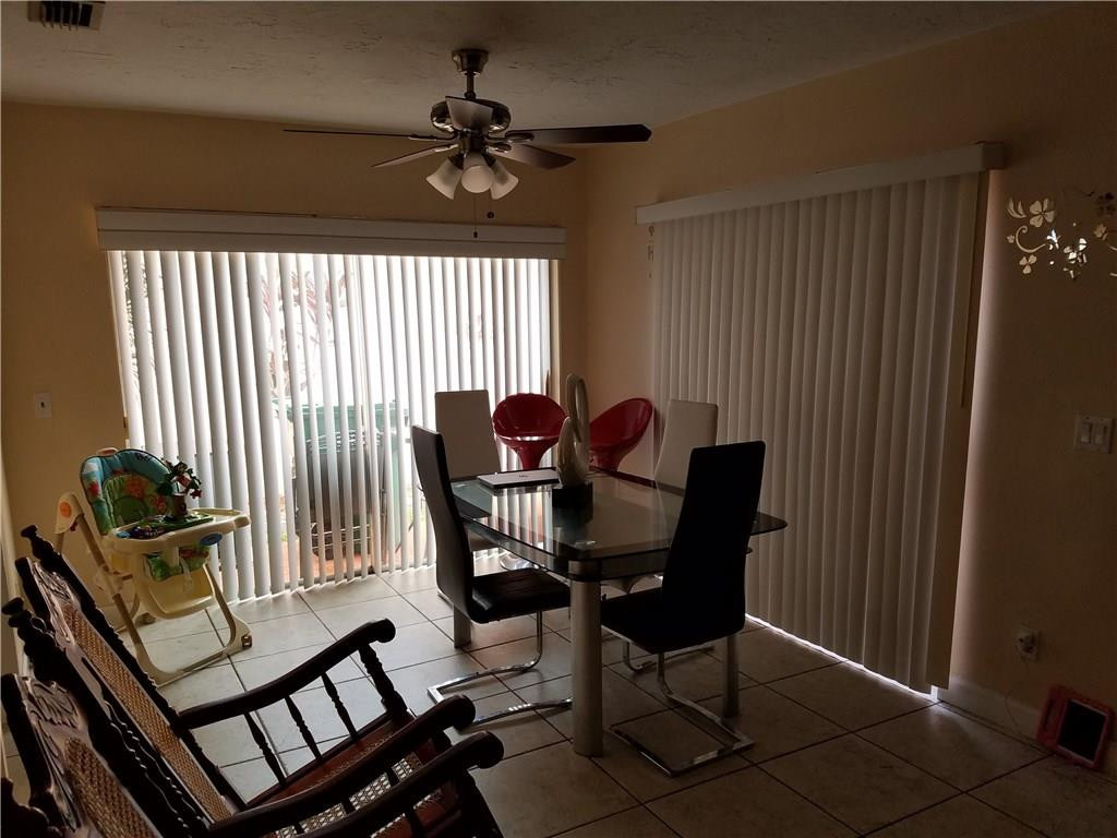 11229 Southwest 152nd Terrace Miami, FL 33157 - Photo 8 of 26 a view of a workspace with furniture and a window