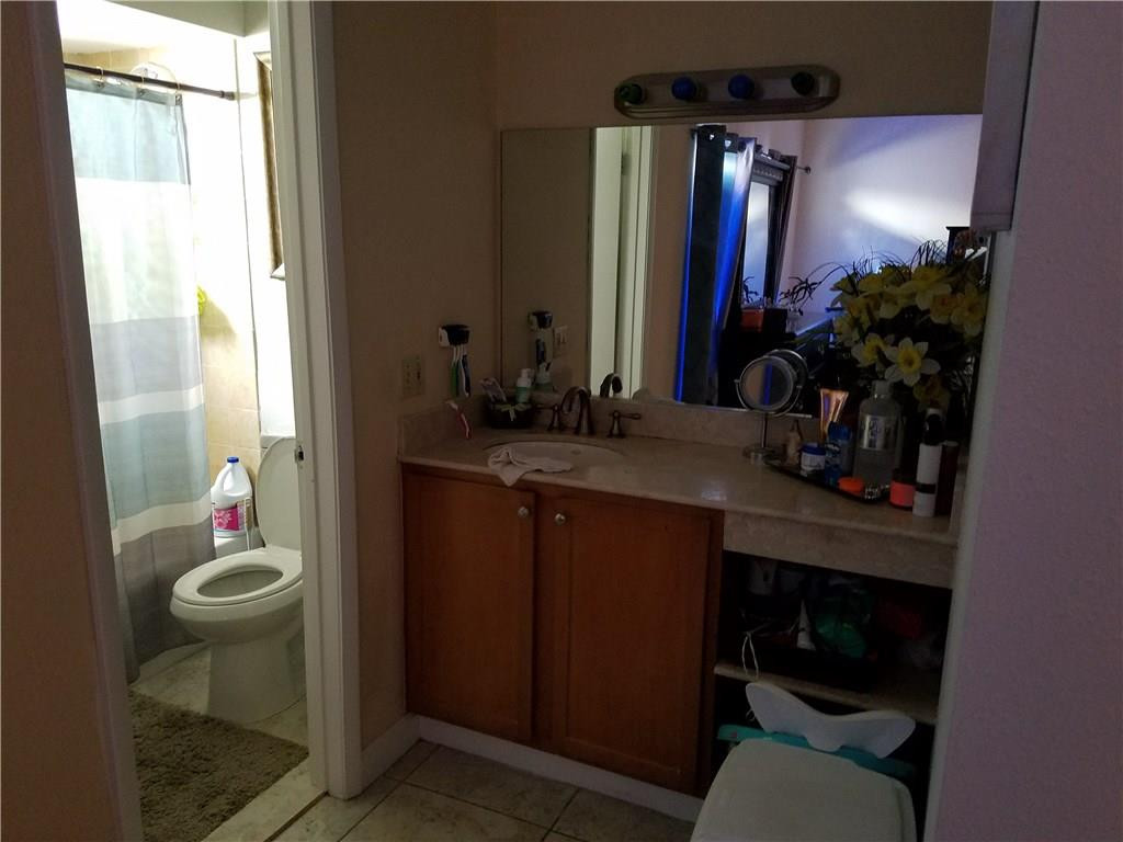 11229 Southwest 152nd Terrace Miami, FL 33157 - Photo 10 of 26 a bathroom with a sink toilet and shower