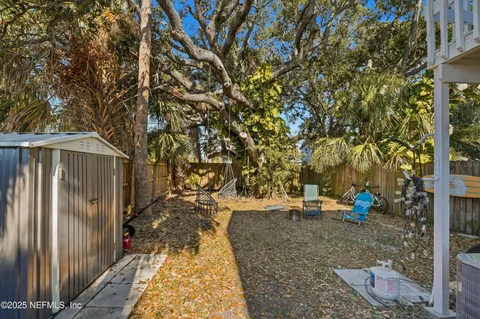 a view of a pathway with a wrought fence