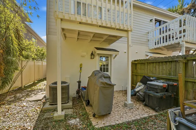 a view of a chairs and a table in the patio