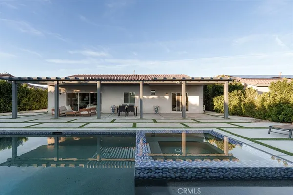 a view of a house with pool table and chairs