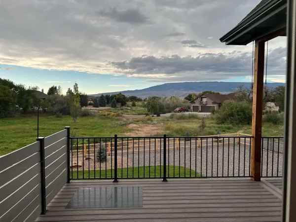 a view of a terrace with wooden fence