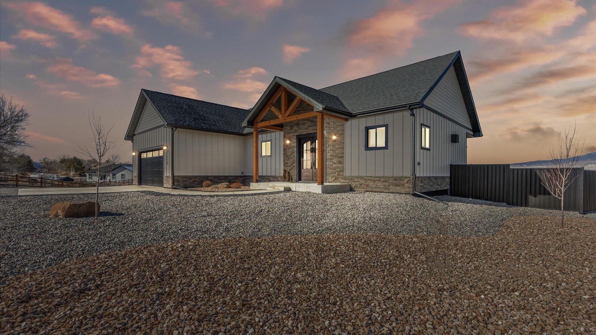 1774 Trapper Court Delta, CO 81416 - Photo 3 of 42 a front view of a house with a yard