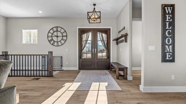 a living room with lots of furniture and a flat screen tv