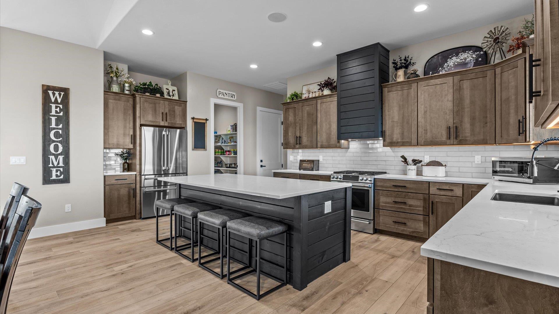 1774 Trapper Court Delta, CO 81416 - Photo 6 of 42 a kitchen with stainless steel appliances granite countertop a stove a sink dishwasher a refrigerator and a oven