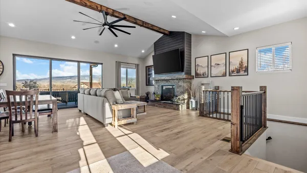 a kitchen with stainless steel appliances granite countertop a wooden cabinets a stove top oven a sink and dishwasher