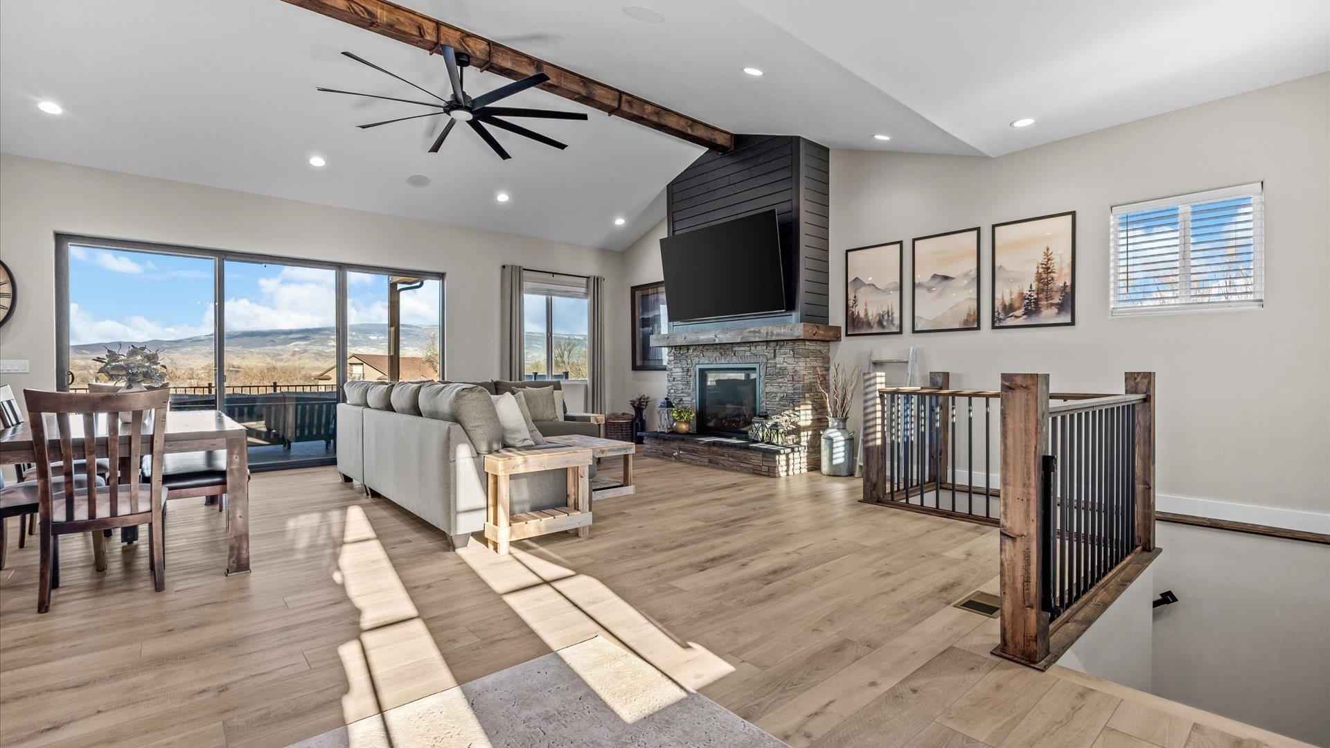 1774 Trapper Court Delta, CO 81416 - Photo 8 of 42 a living room with lots of furniture and a flat screen tv