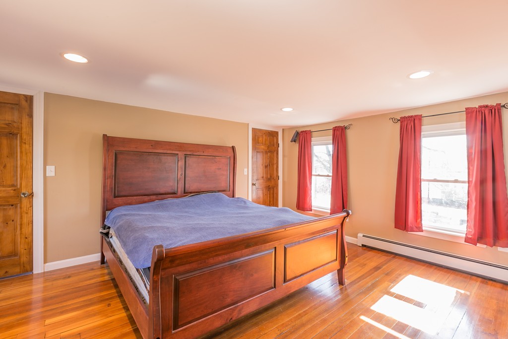 1161 Thompson Road, Unit RD Thompson, CT 06277 - Photo 10 of 13 a bedroom with a bed and a large window
