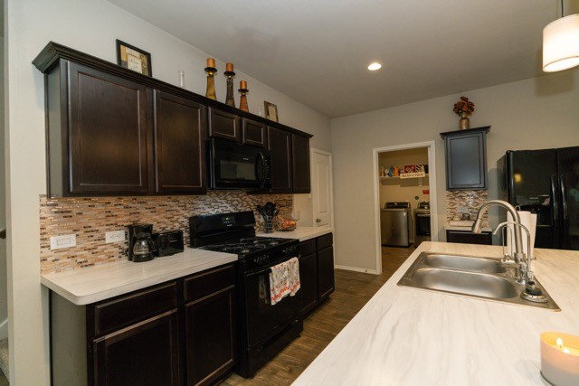 23123 Barrington Bluff Trail Spring, TX 77373 - Photo 11 of 50 a kitchen with stainless steel appliances a sink stove and refrigerator