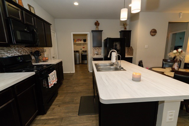 23123 Barrington Bluff Trail Spring, TX 77373 - Photo 14 of 50 a kitchen with kitchen island a sink appliances and cabinets