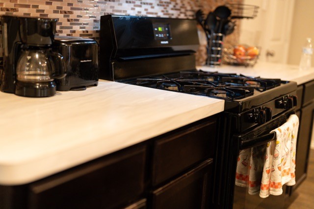 23123 Barrington Bluff Trail Spring, TX 77373 - Photo 19 of 50 a kitchen with a stove and a refrigerator
