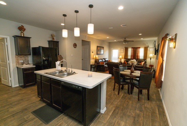 23123 Barrington Bluff Trail Spring, TX 77373 - Photo 21 of 50 a large kitchen with a table chairs and refrigerator