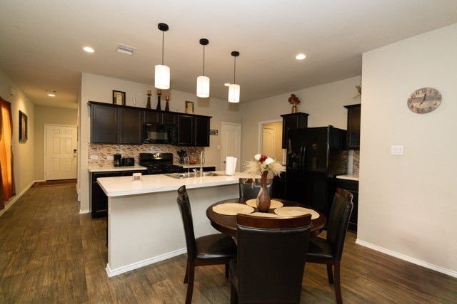 23123 Barrington Bluff Trail Spring, TX 77373 - Photo 22 of 50 a kitchen with a dining table and chairs