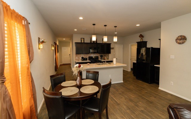 23123 Barrington Bluff Trail Spring, TX 77373 - Photo 23 of 50 a kitchen with a table and chairs in it