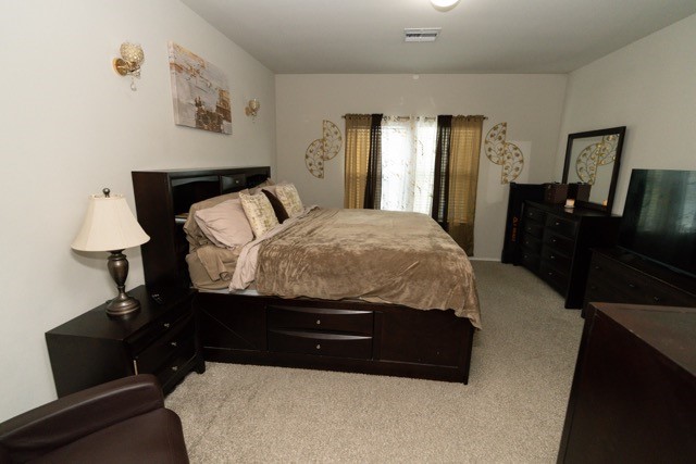 23123 Barrington Bluff Trail Spring, TX 77373 - Photo 26 of 50 a bedroom with a bed and a dresser