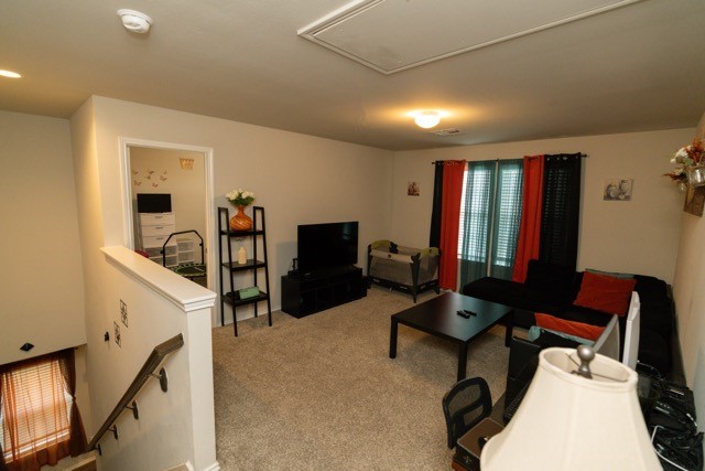 23123 Barrington Bluff Trail Spring, TX 77373 - Photo 34 of 50 a work room with furniture and a flat screen tv