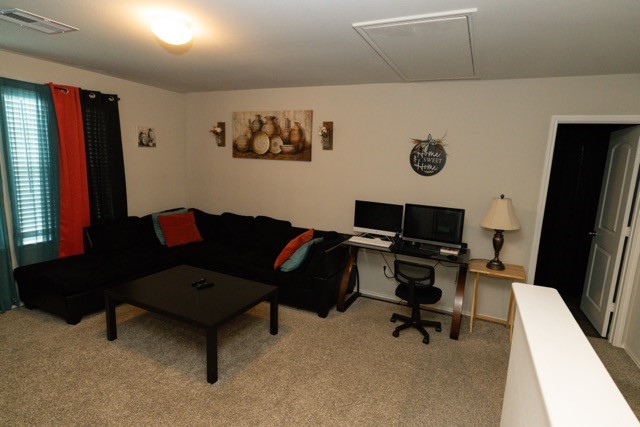 23123 Barrington Bluff Trail Spring, TX 77373 - Photo 37 of 50 a living room with furniture and a flat screen tv