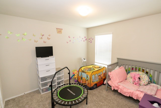 23123 Barrington Bluff Trail Spring, TX 77373 - Photo 39 of 50 a bedroom with bed and a window