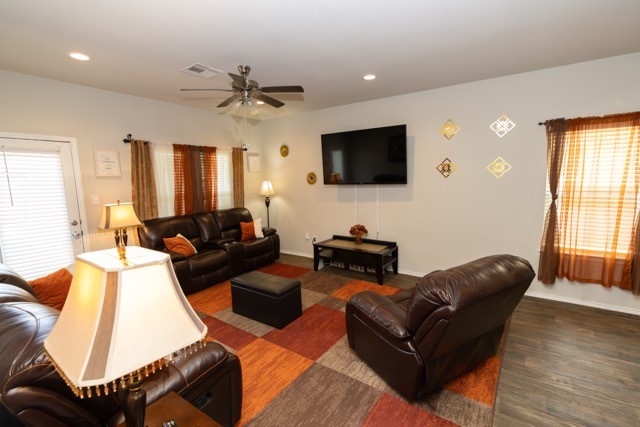 23123 Barrington Bluff Trail Spring, TX 77373 - Photo 4 of 50 a living room with furniture a flat screen tv and a window