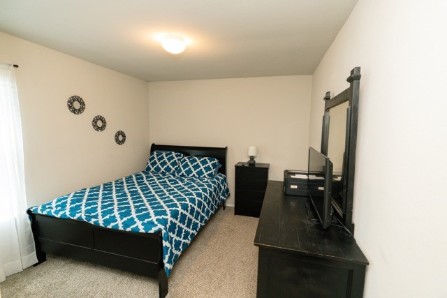 23123 Barrington Bluff Trail Spring, TX 77373 - Photo 41 of 50 a bed room with a bed and a night stand