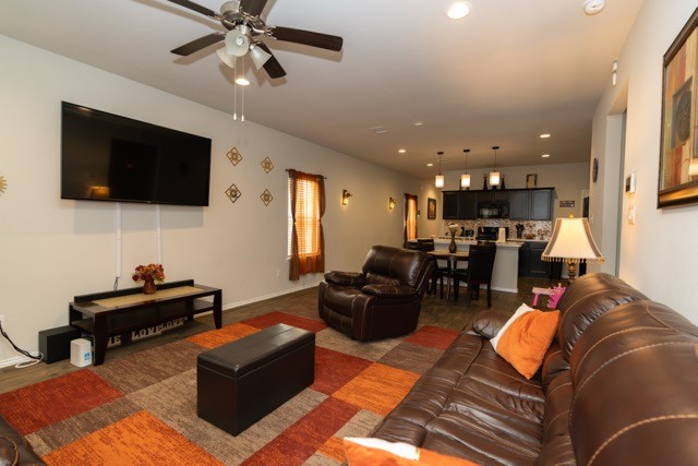 23123 Barrington Bluff Trail Spring, TX 77373 - Photo 5 of 50 a living room with furniture and a flat screen tv