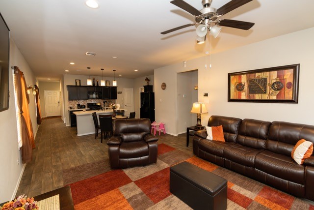 23123 Barrington Bluff Trail Spring, TX 77373 - Photo 6 of 50 a living room with furniture and kitchen view