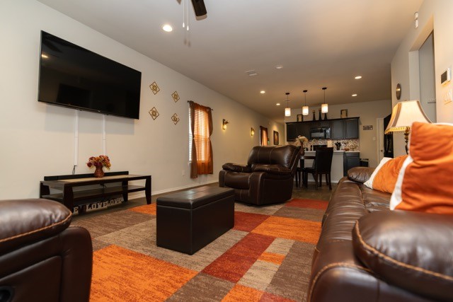 23123 Barrington Bluff Trail Spring, TX 77373 - Photo 7 of 50 a living room with furniture and a flat screen tv
