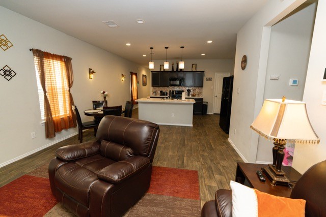 23123 Barrington Bluff Trail Spring, TX 77373 - Photo 8 of 50 a living room with furniture and a flat screen tv