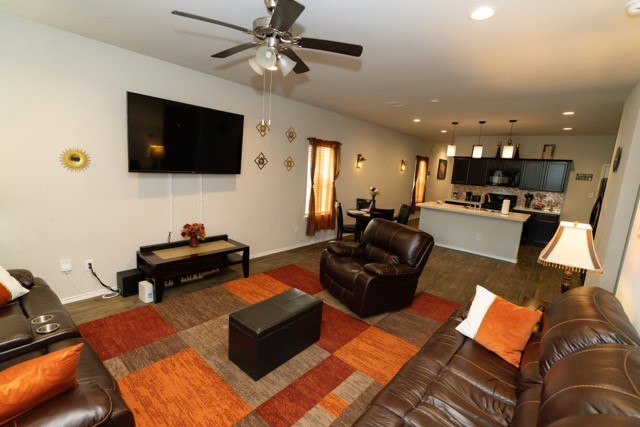 23123 Barrington Bluff Trail Spring, TX 77373 - Photo 9 of 50 a living room with furniture and a flat screen tv