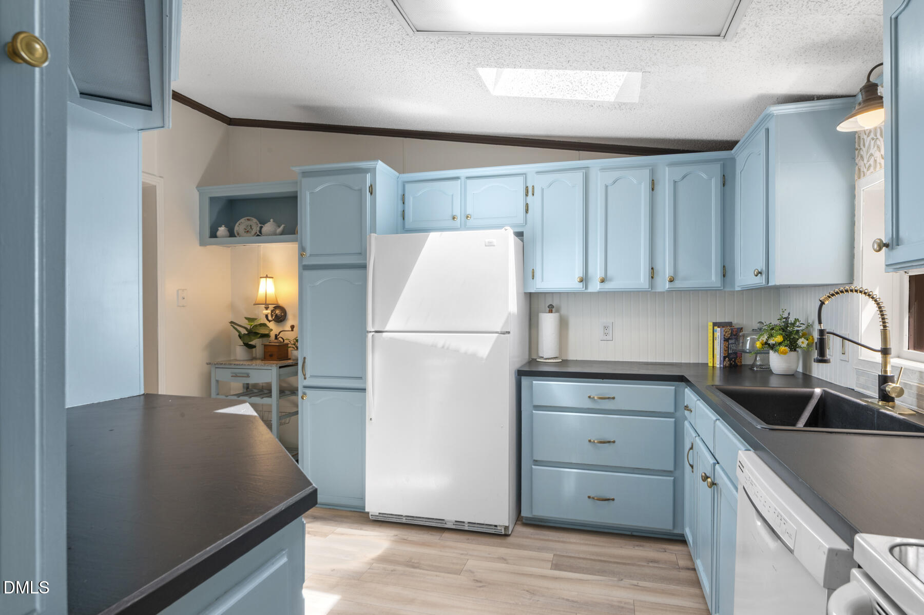 492 Little Mill Road Henderson, NC 27537 - Photo 14 of 39 a kitchen with a refrigerator and a sink