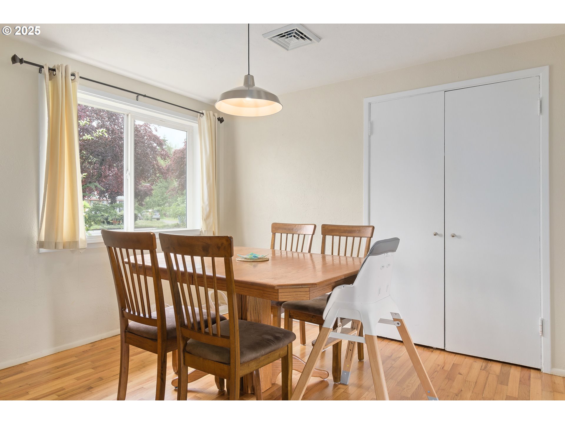 3417 Harlow Road Eugene, OR 97401 - Photo 12 of 40 a view of a dining room with furniture window and wooden floor