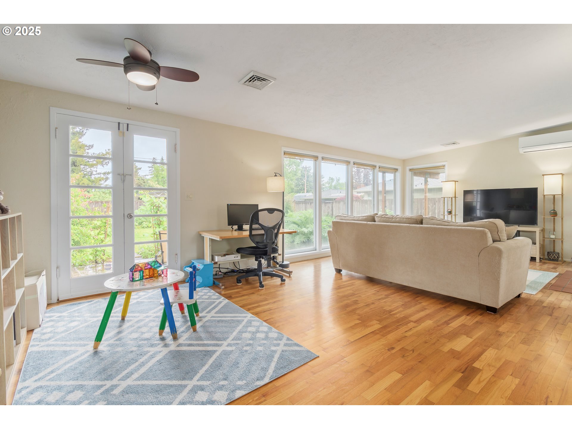 3417 Harlow Road Eugene, OR 97401 - Photo 15 of 40 a living room with furniture and a flat screen tv