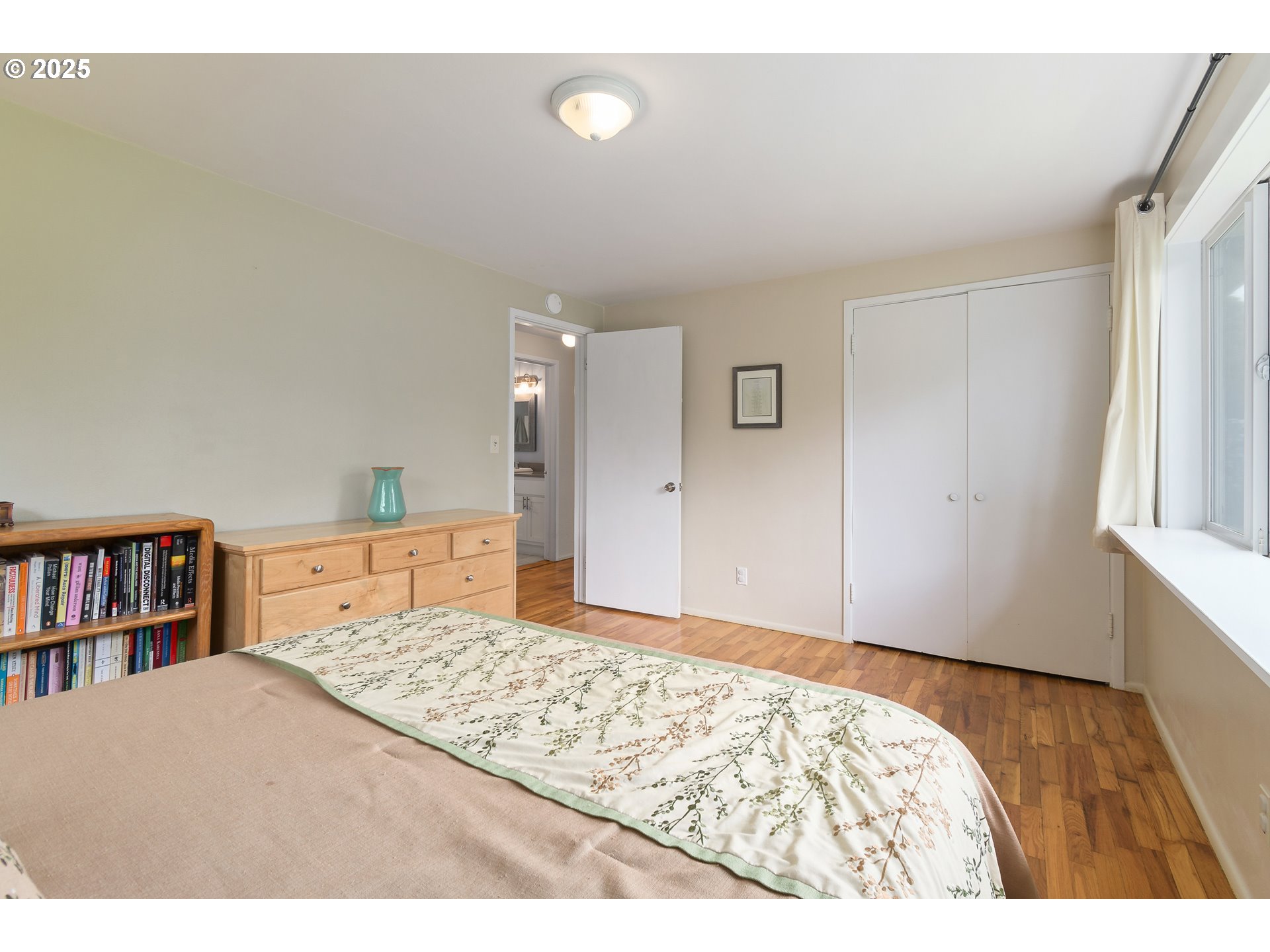 3417 Harlow Road Eugene, OR 97401 - Photo 22 of 40 a bedroom with a bed and a book shelf